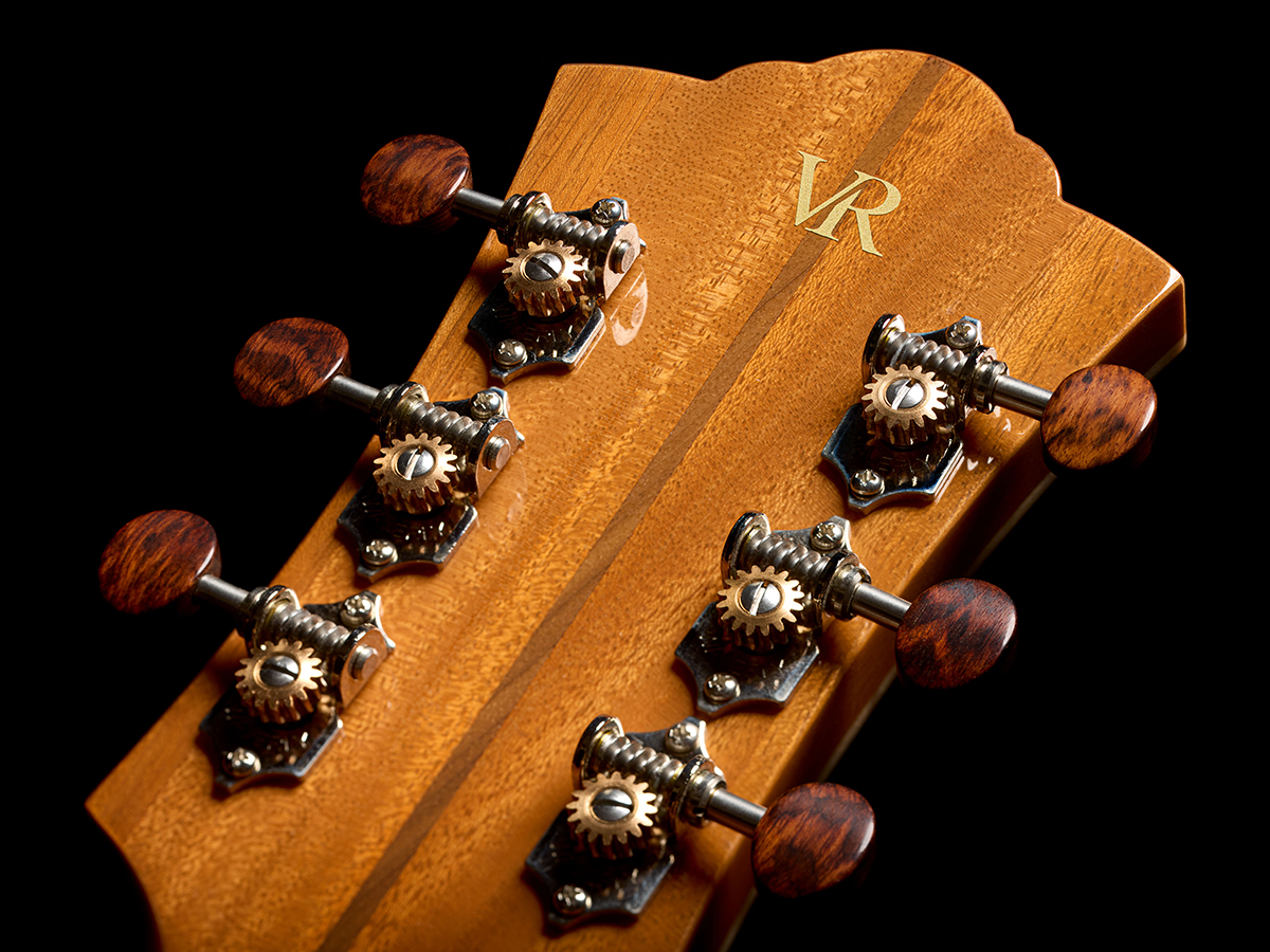 Close-up of VR1 F-40 Au Naturel back of headstock showcasing deluxe tuners with snakewood buttons