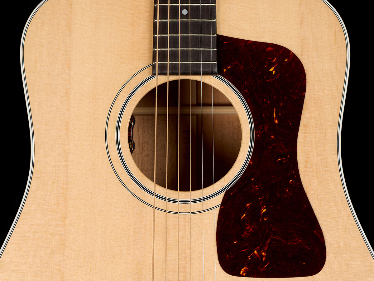 Close-up of D-40E Standard Natural soundhole showcasing the L.R. Baggs Element VTC pickup system