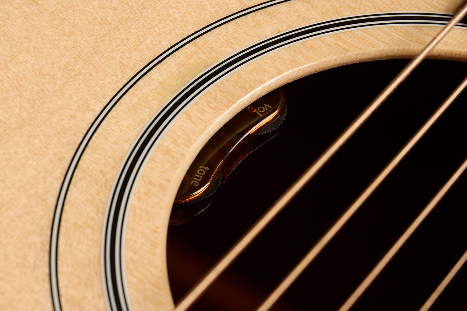 Close-up of D-40E Standard Natural soundhole showcasing the L.R. Baggs Element VTC pickup system