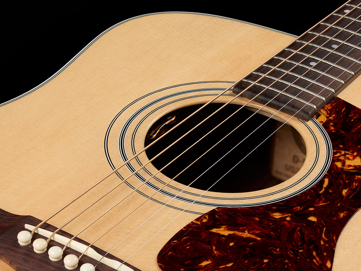 Close-up of D-50E Standard Natural soundhole showcasing the L.R. Baggs Element VTC pickup system