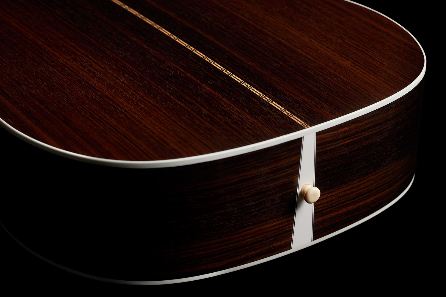 Close-up of M-50 Standard Natural back showcasing solid Indian rosewood back and strap pin