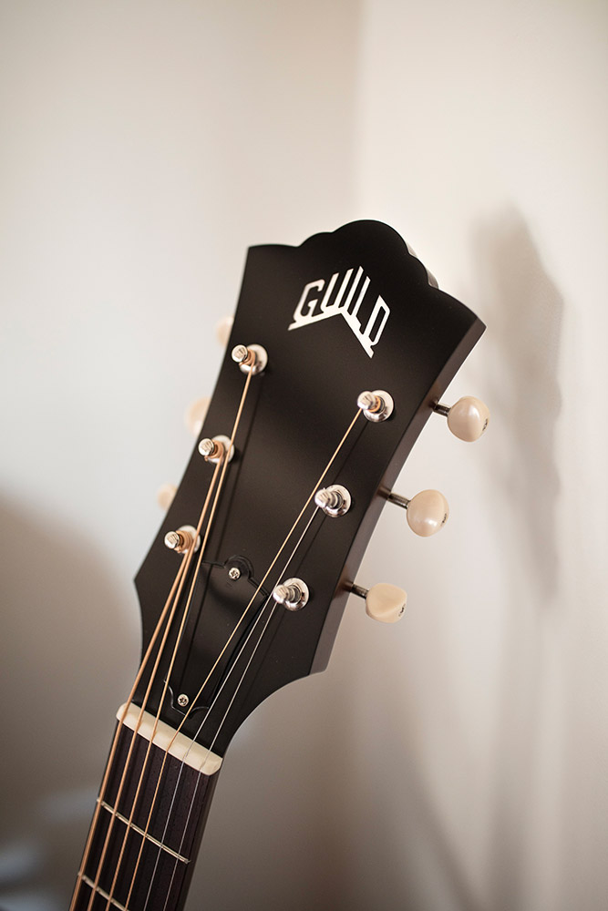 Close-up of F-40 Standard Natural headstock with Guild peak logo