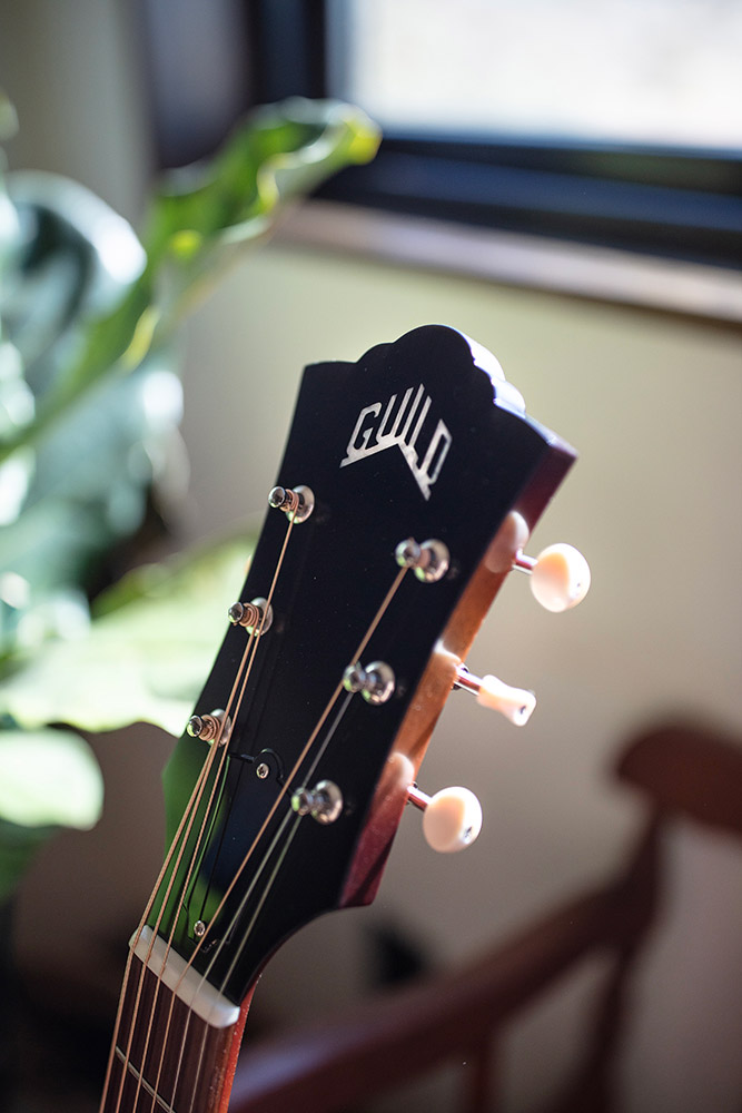 Close-up of F-40 Standard Pacific Sunset Burst headstock with Guild peak logo