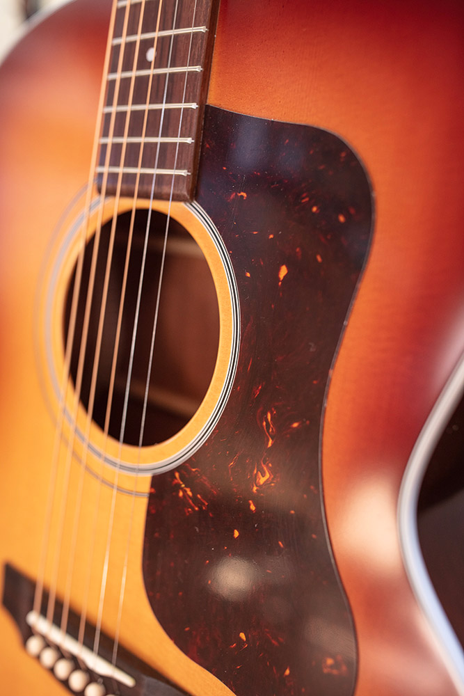 Close-up of F-40 Standard Pacific Sunset Burst pickguard