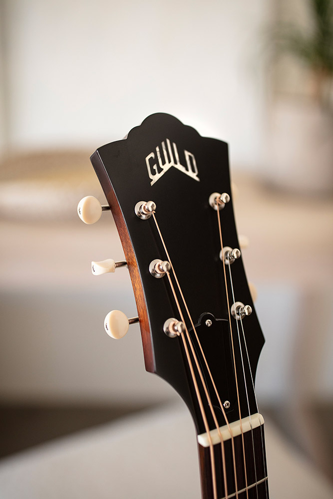 Close-up of D-40 Standard Pacific Sunset Burst headstock with Guild Peak logo