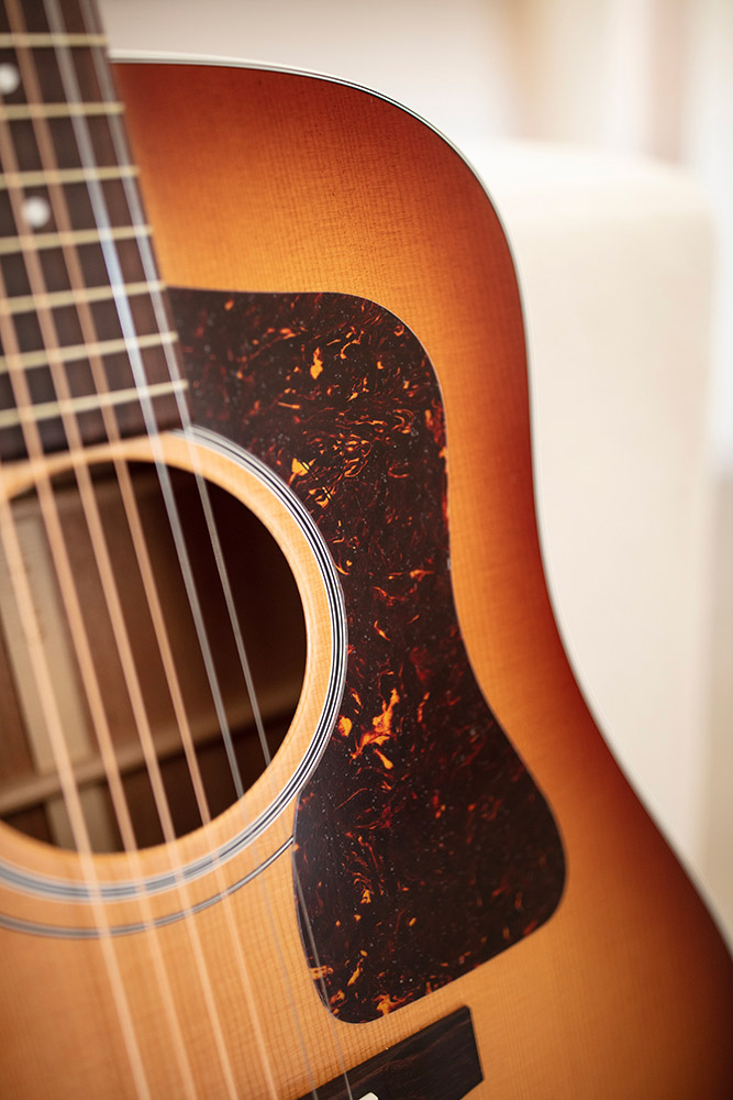 Close-up of D-40 Standard Pacific Sunset Burst pickguard