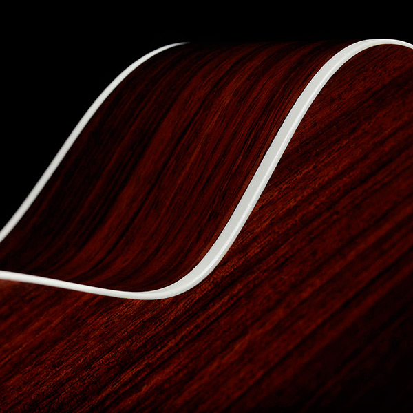 Close-up of M-50 Standard Antique Burst back and side showcasing solid Indian rosewood and white ABS binding thumb