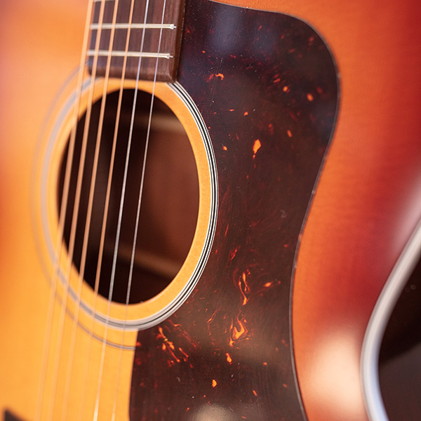 Close-up of F-40 Standard Pacific Sunset Burst pickguard thumb