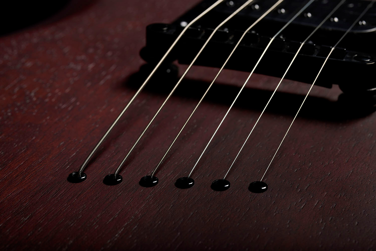 Close-up of Polara Limited Night Edition Vintage Walnut strings