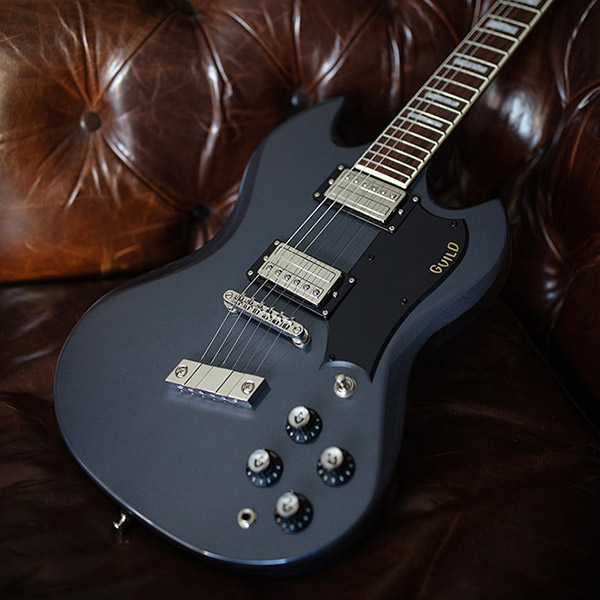 Polara Deluxe Canyon Dusk laying on leather couch thumb