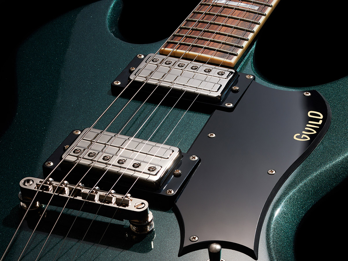 Close-up of Polara Deluxe Kingswood Green Pickguard and Pickups