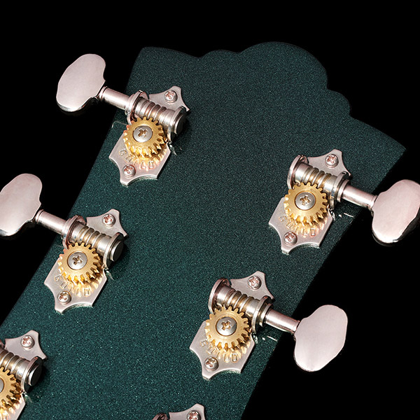 Close-up of Polara Deluxe Kingswood Green back of headstock thumb