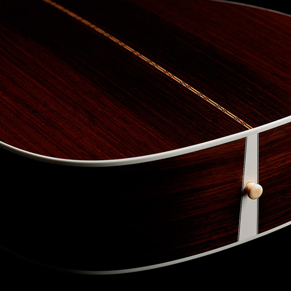 View of M-50 Standard Antique Burst back showcasing solid Indian rosewood back and strap pin thumb