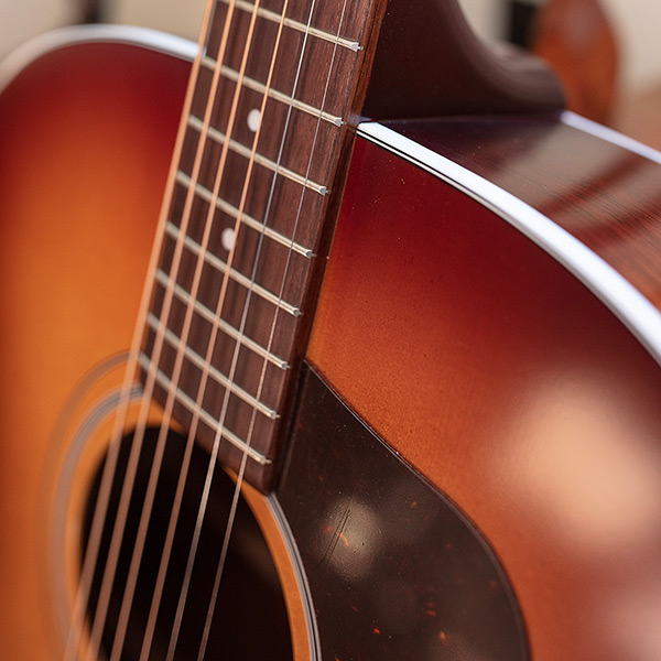 Close-up of F-40 Standard Pacific Sunset Burst neck and strings thumb