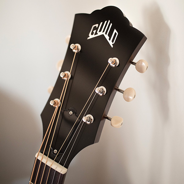 Close-up of F-40 Standard Natural headstock with Guild peak logo thumb