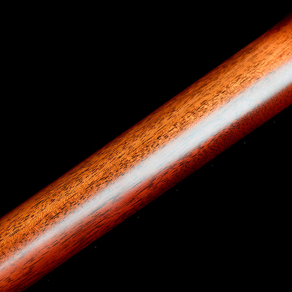 Close-up back view of mahogany M-40 Standard Pacific Sunset Burst neck thumb