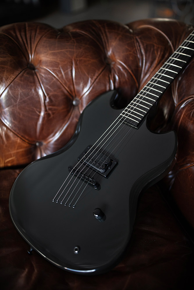 Polara Night Edition Tungsten laying on a leather couch