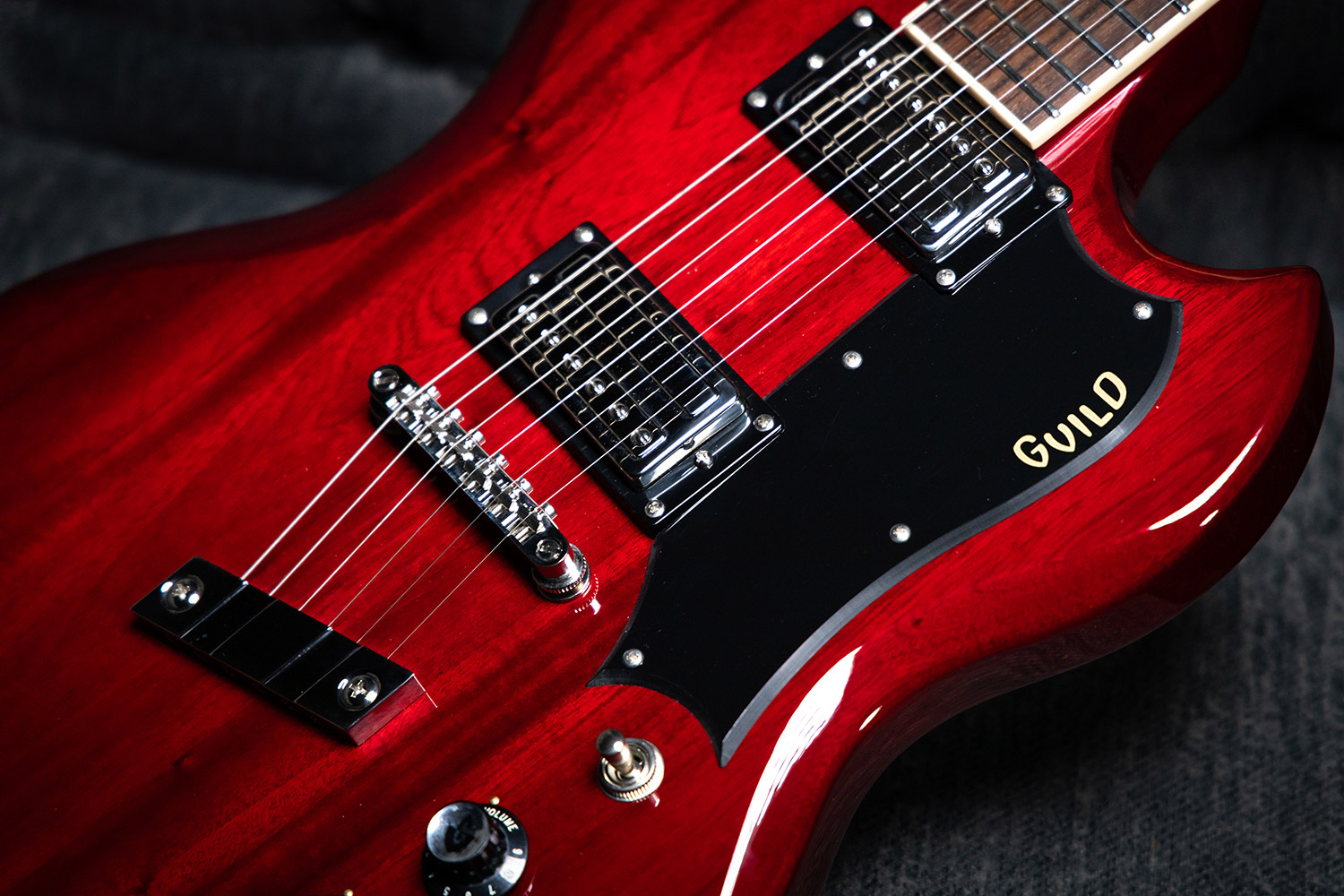 Close-up of the Polara Deluxe Cherry Red body featuring pickups and pickguard