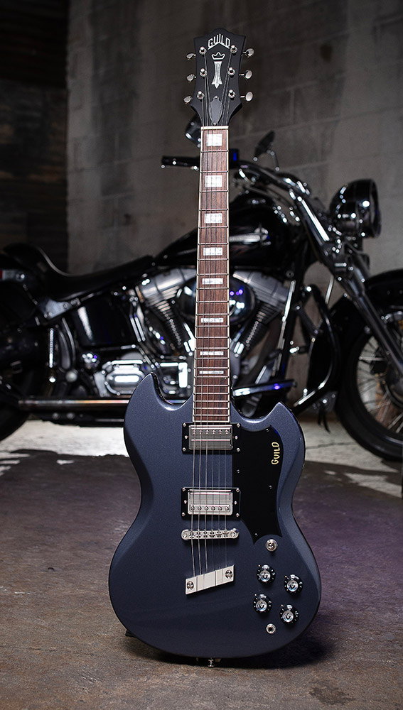 Polara Deluxe Canyon Dusk on a concrete floor with motorcycle behind