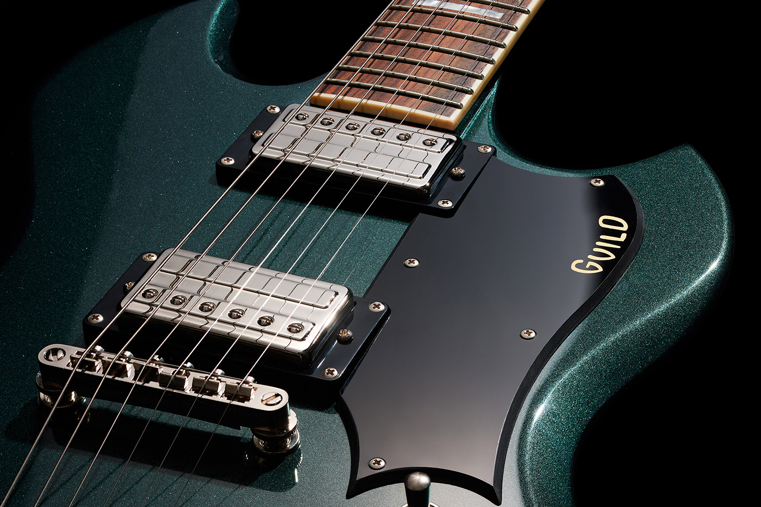 Close-up of back of the Polara Deluxe Kingswood Green pick guard with Giuld logo