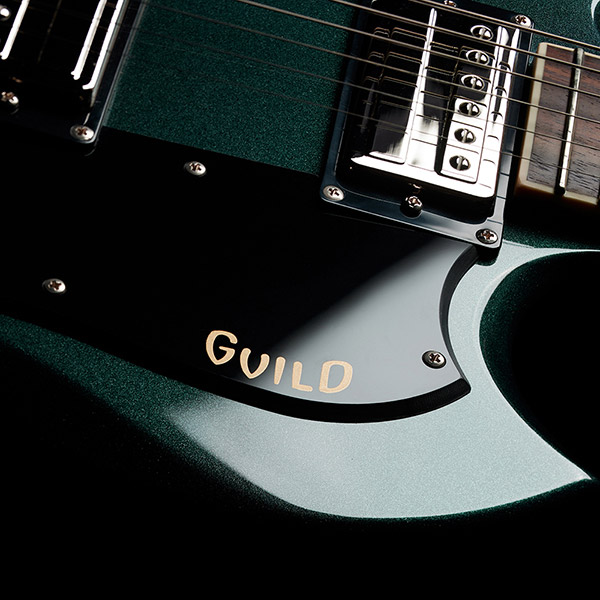 Close-up of Polara Deluxe Kingswood Green pick guard with Giuld logo thumb