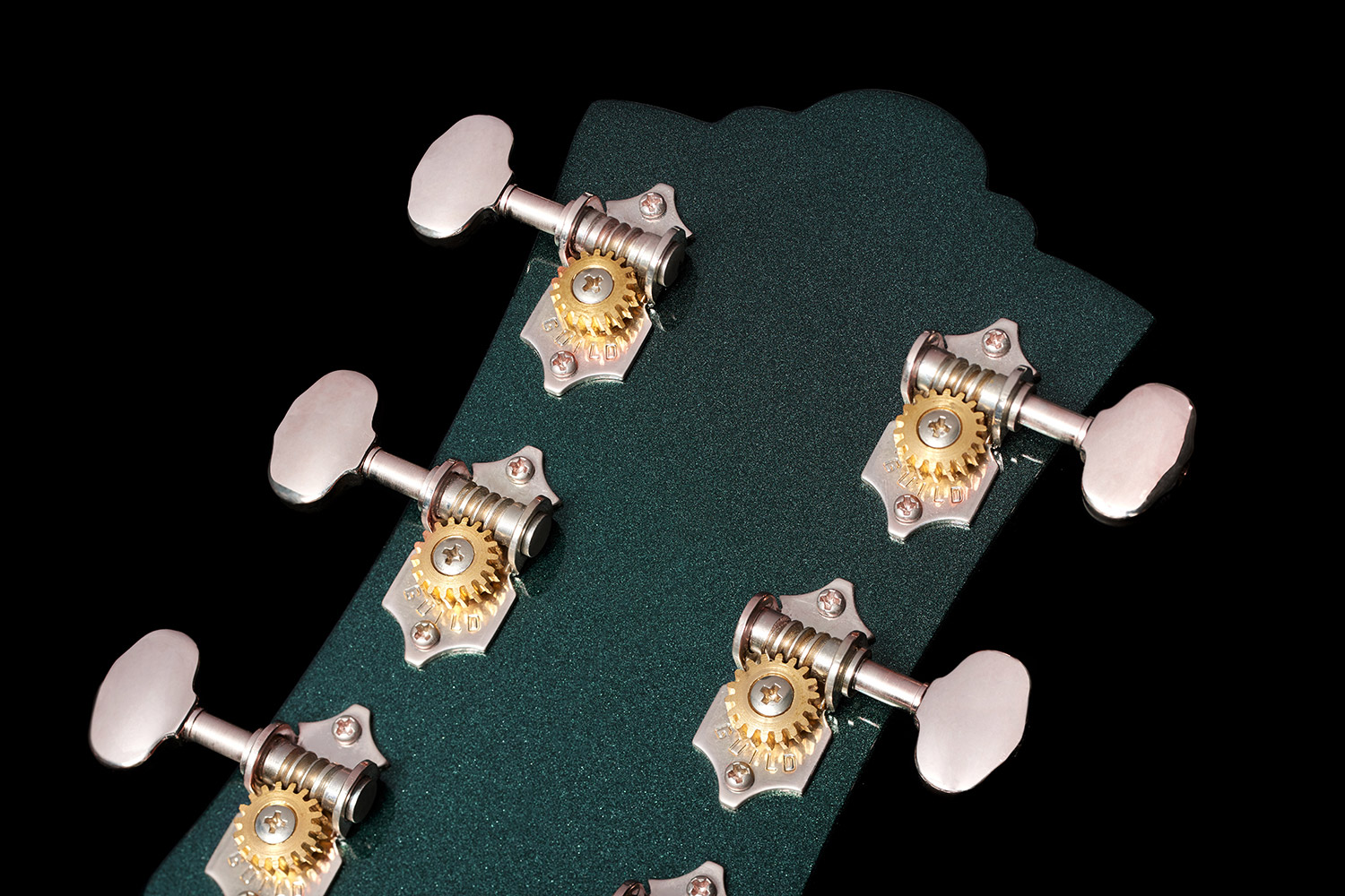Close-up of Polara Deluxe Kingswood Green back of headstock