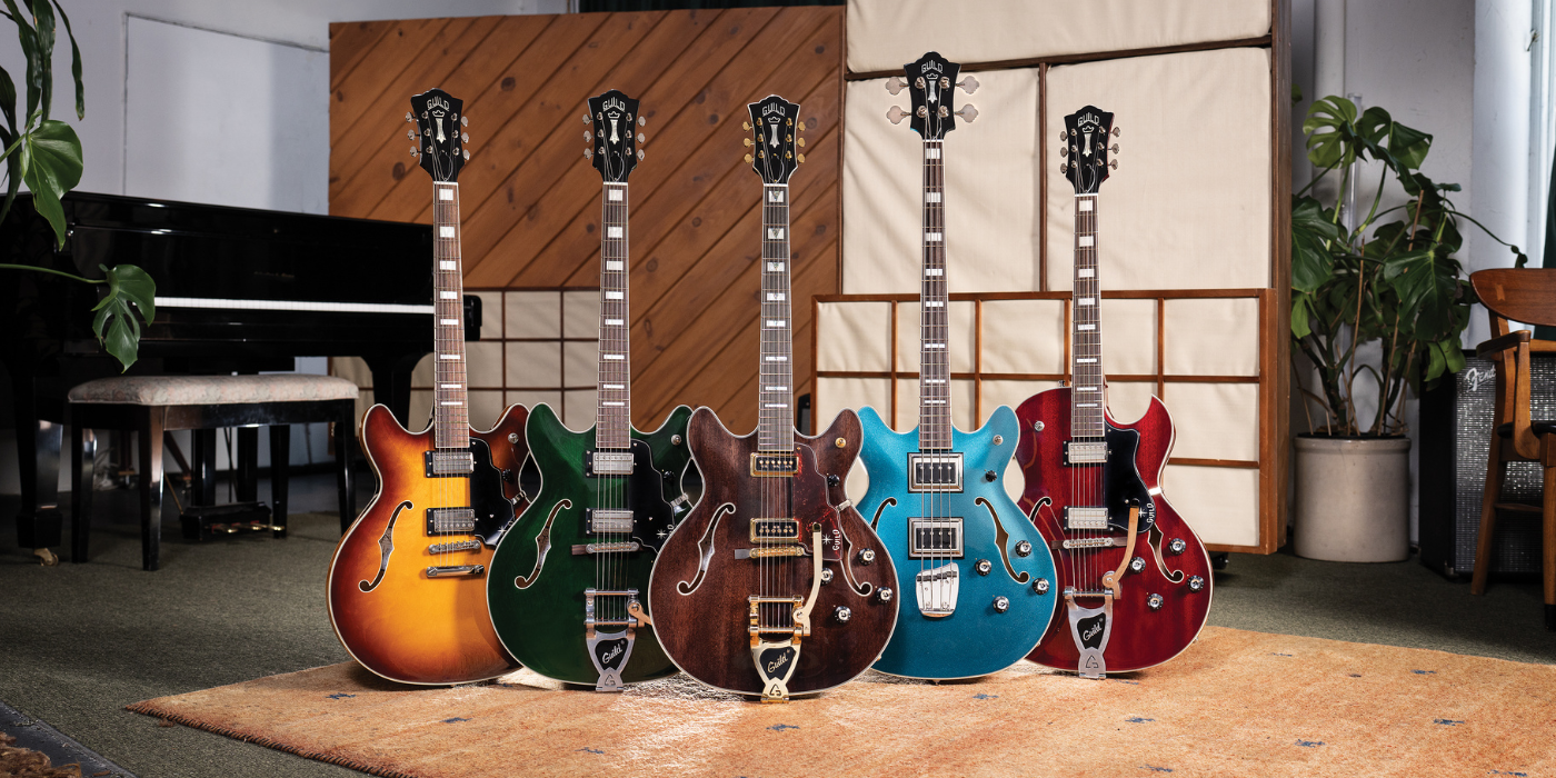 Select Newark St Collection Starfire guitars lined up in a studio with piano.