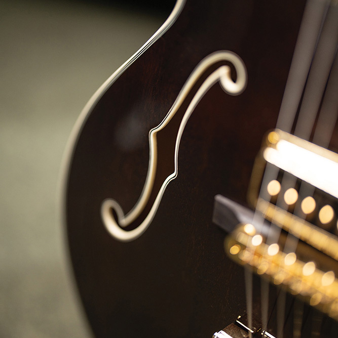 Close-up of the F-hole on a Starfire Custom DC GVT GH, showing the mahogany top grain and ivory purfling.