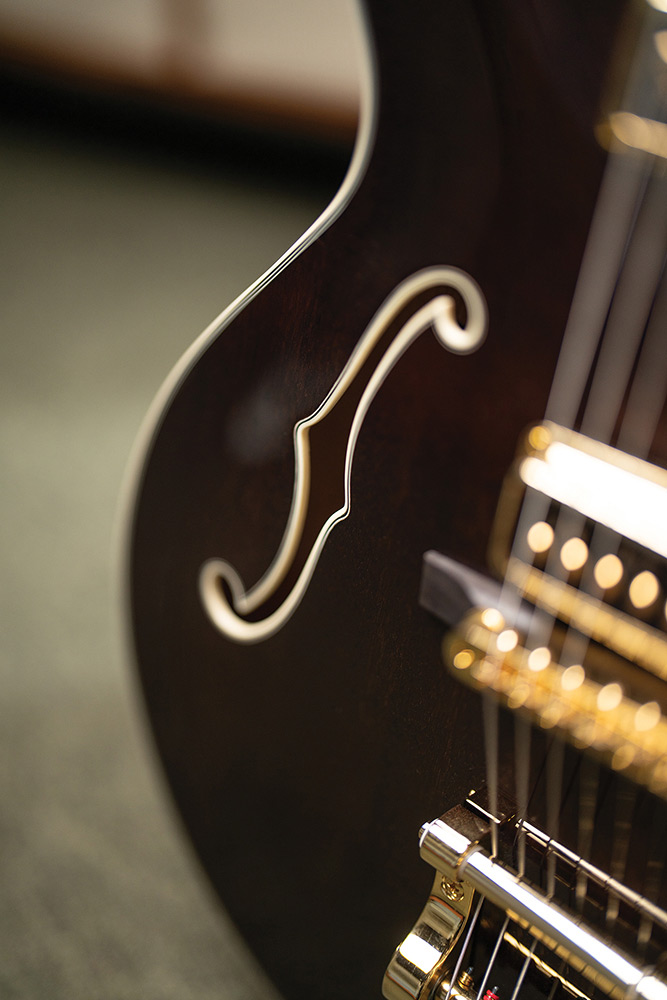 Close-up of the F-hole on a Starfire Custom DC GVT GH, showing the mahogany top grain and ivory purfling.