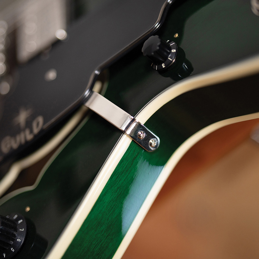 Close-up of a Starfire Deluxe DC GVT Emerald Green, showing the pickguard and ivory body binding.