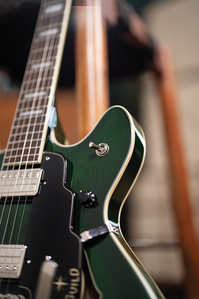 Close-up of the neck and cutaway on a Starfire Deluxe DC GVT Emerald Green, showing the pickup selector switch and pickguard.
