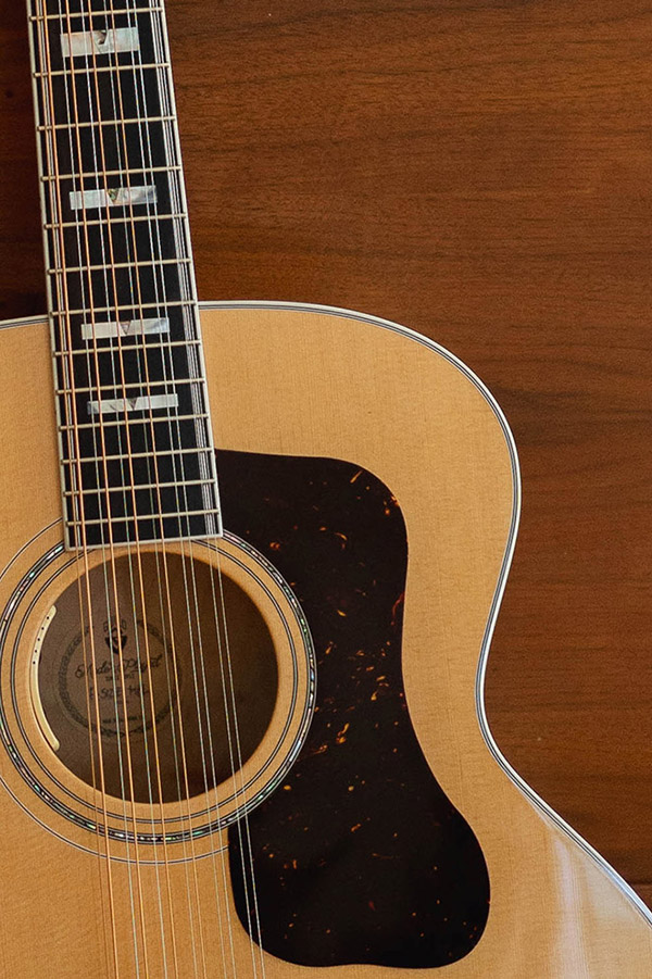 Close up of Guild F-512 Maple Blonde soundhole and pickguard thumbnail