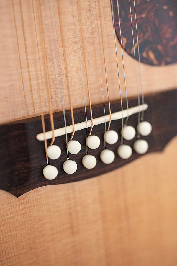 Close up of Guild F-512 Maple Blonde bridge thumbnail