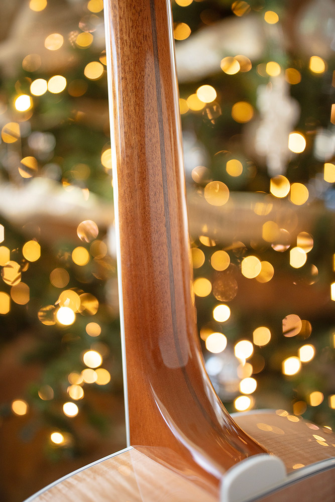 Close up of Guild F-512 back of neck showcasing Mahogany with Walnut strip