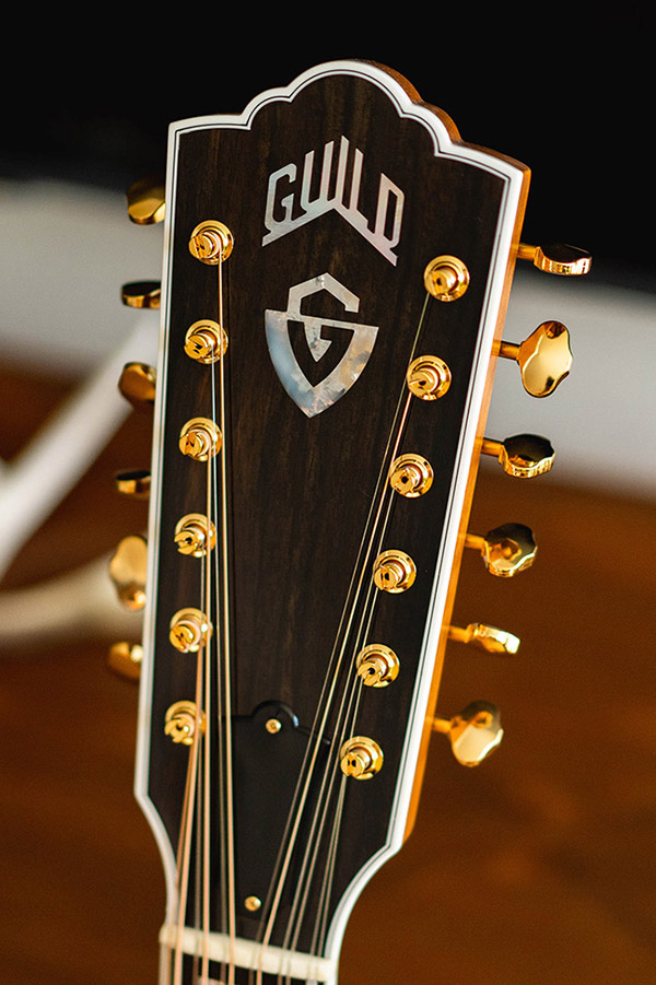 Close up of Guild F-512 Maple headstock with Guild Peak logo thumbnail