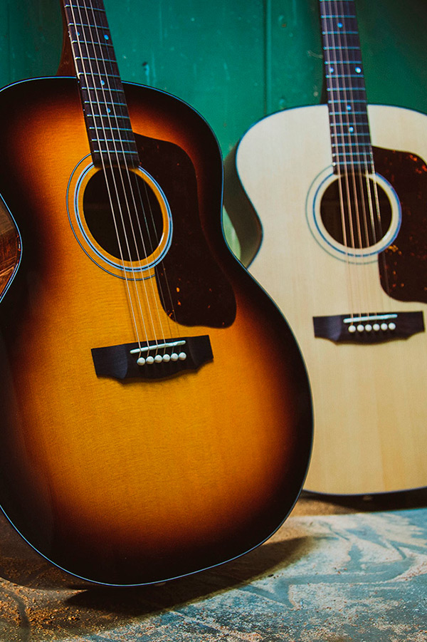 F-40 Natural and Antique Burst acoustic guitars are displayed side by side.